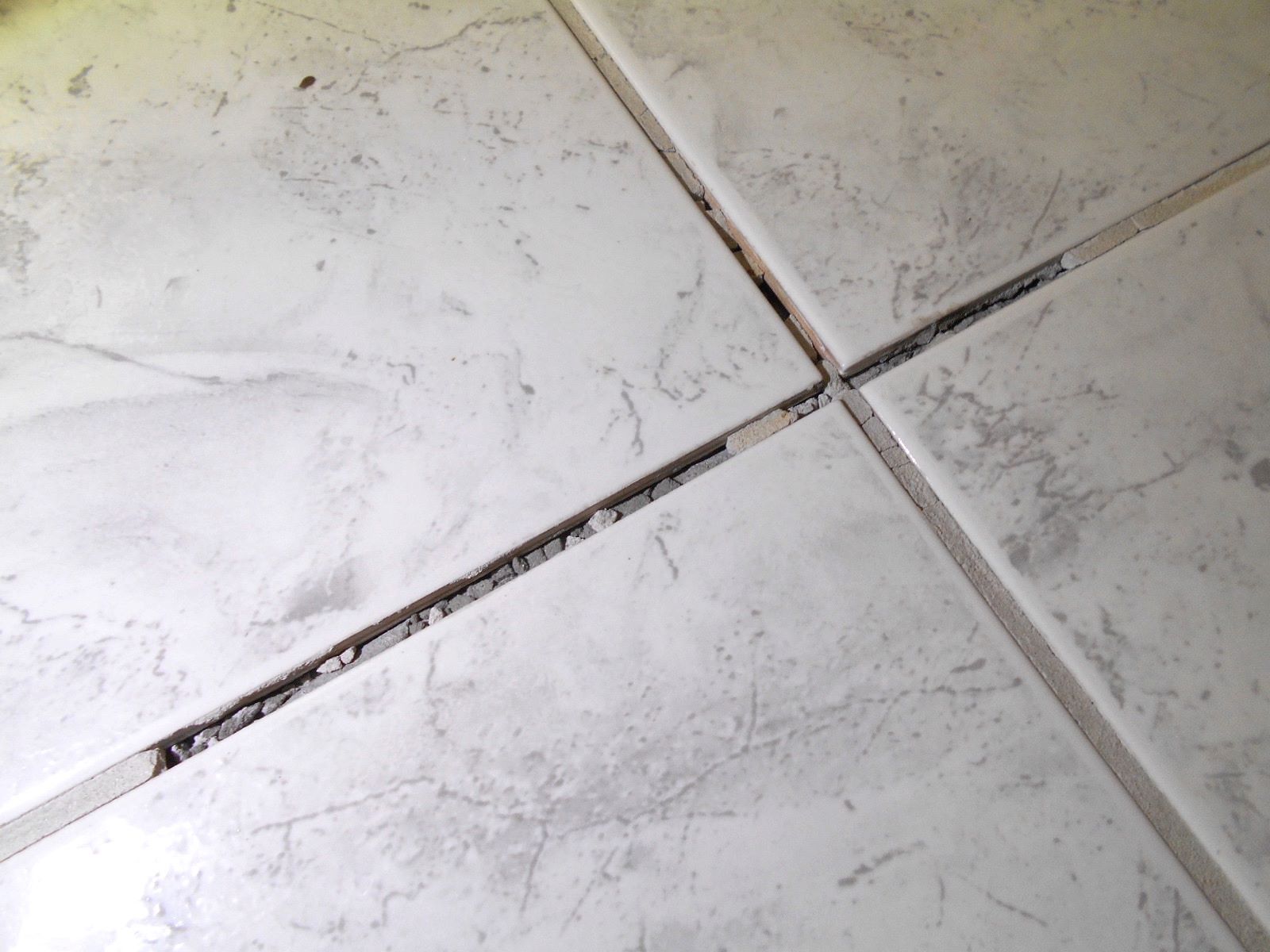 Revive Your Cracked Grout With This Genius Hack!