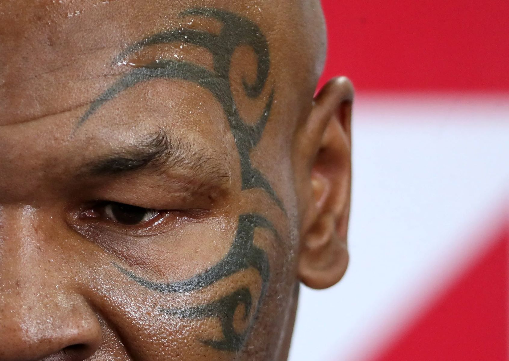 The Shocking Reason Behind Mike Tyson's Infamous Face Tattoo