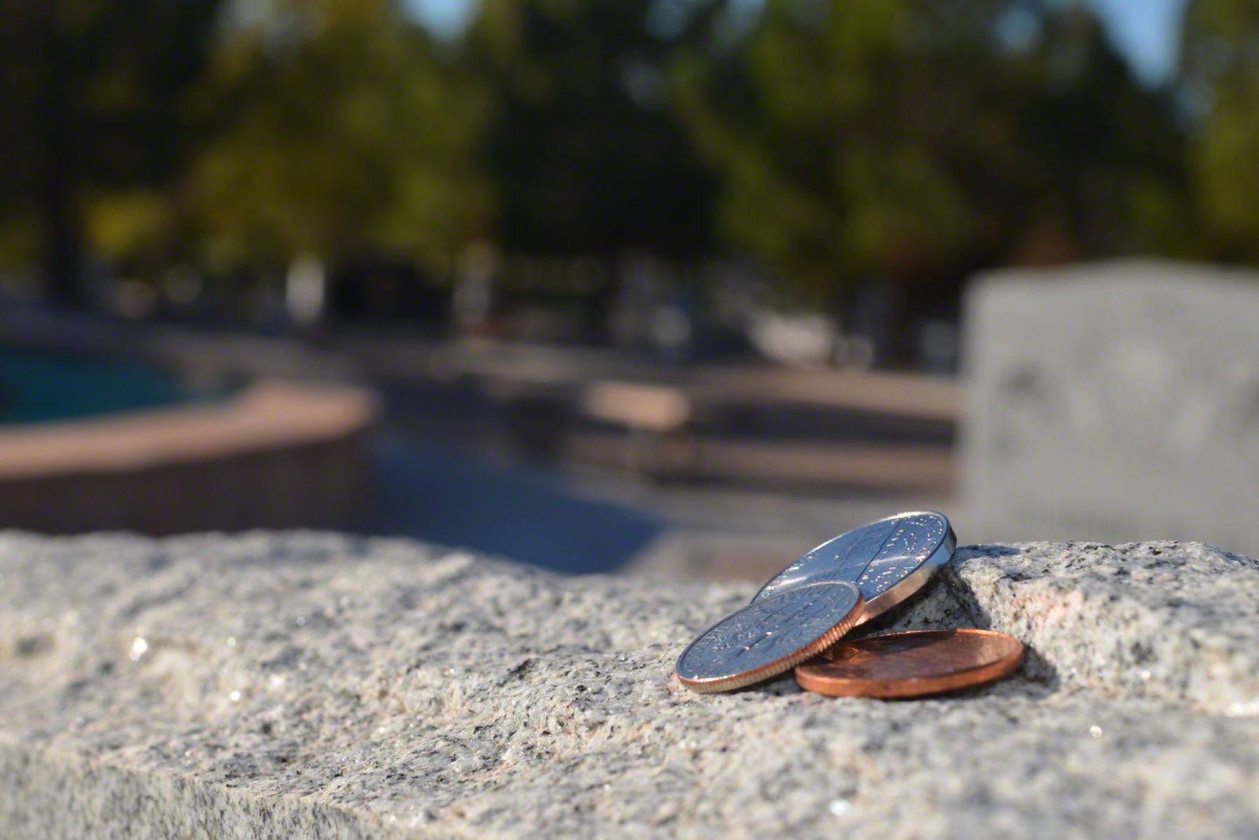 The Surprising Reason People Place Pennies On Graves